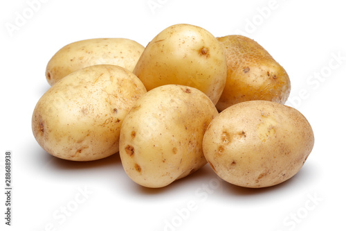 Heap of fresh potatoes isolated on white background