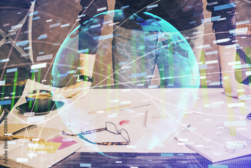 Double exposure of Man writing in notepad with business icons on background. Double exposure of Man writing in notepad with business icons on background.