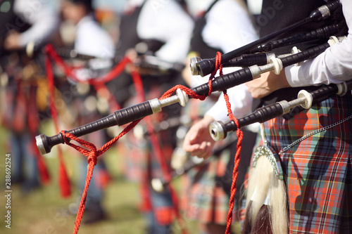 Scottish bagpipe marching band close up on bagpipes photo