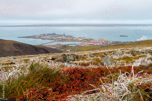 View from the hills to the port town on the coast of the Arctic Ocean. Pevek is the northernmost city in Russia. Frosts in August in the Arctic tundra. Pevek, Chukotka, Polar Siberia, Russian Far East photo