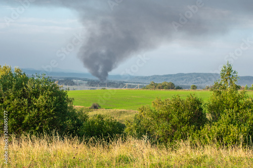 black smoke in the field burns