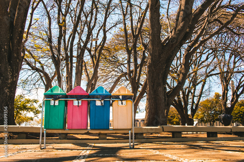Selective collection bins ( lixeiras - coleta seletiva de lixo ) in public square in urban military sector in Brasília - Brazil / civic square photo