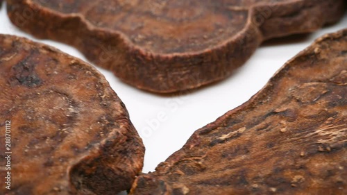 side view herb medicine HeShouWu or Polygoni Multiflori Radix or Tuber Fleeceflower Root rotate and pause photo