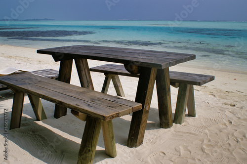 Tourist table on Picnic Island near Maafushi Island Maldives © MikeCloud
