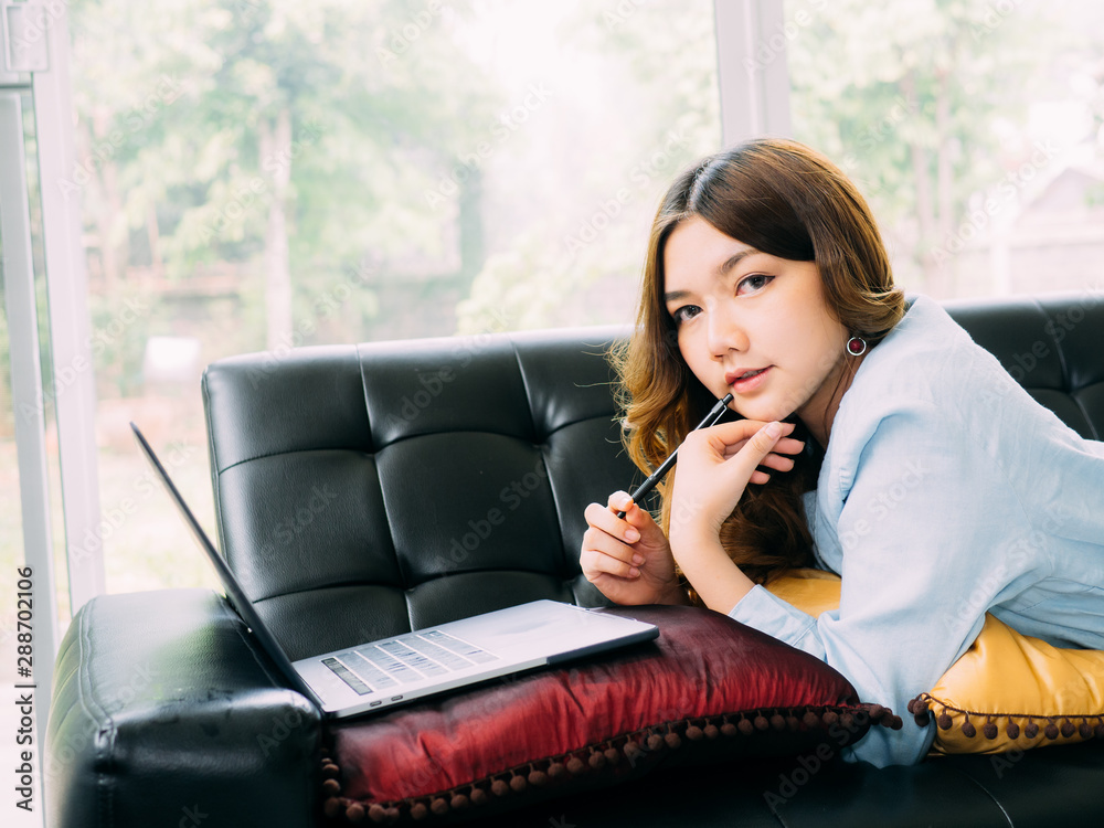 Pretty asian woman internet online work at home and relax lifestyle with her labtop Pretty asian woman internet online work at home and relax lifestyle with her labtop