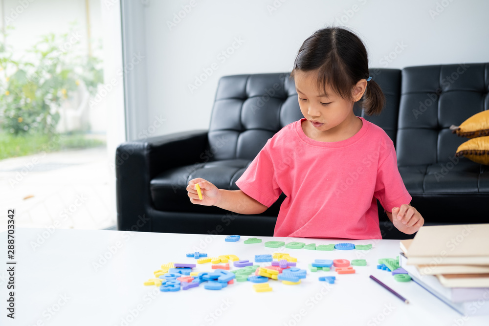 Asian kid during do homework and self learning at home Asian kid during do homework and self learning at home
