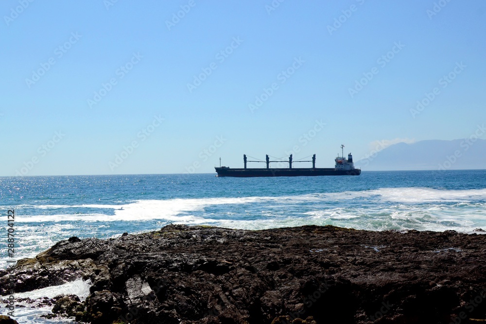 A cargo ship sailing off the coast of Antofagasta, Chile A cargo ship sailing off the coast of Antofagasta, Chile