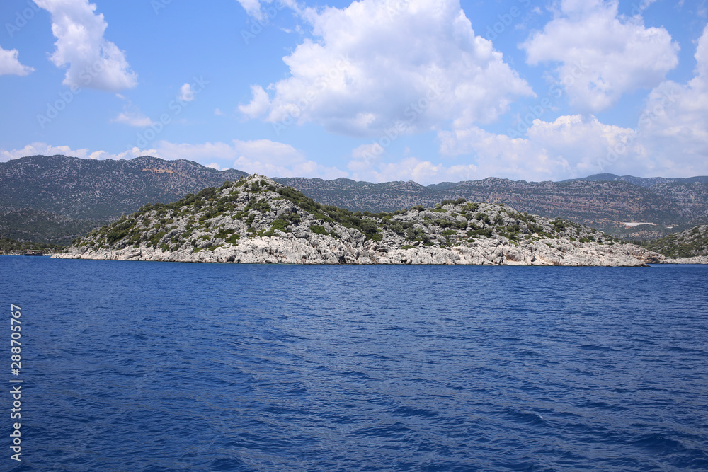 Rocky island with two peaks in the Mediterranean Sea. Near the city of Fethiye, Mugla Province, Turkey.