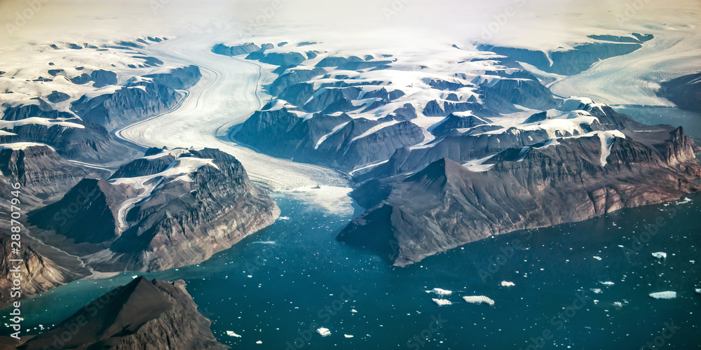 Western coast of Greenland, aerial view of glacier,  mountains and ocean - obrazy, fototapety, plakaty 