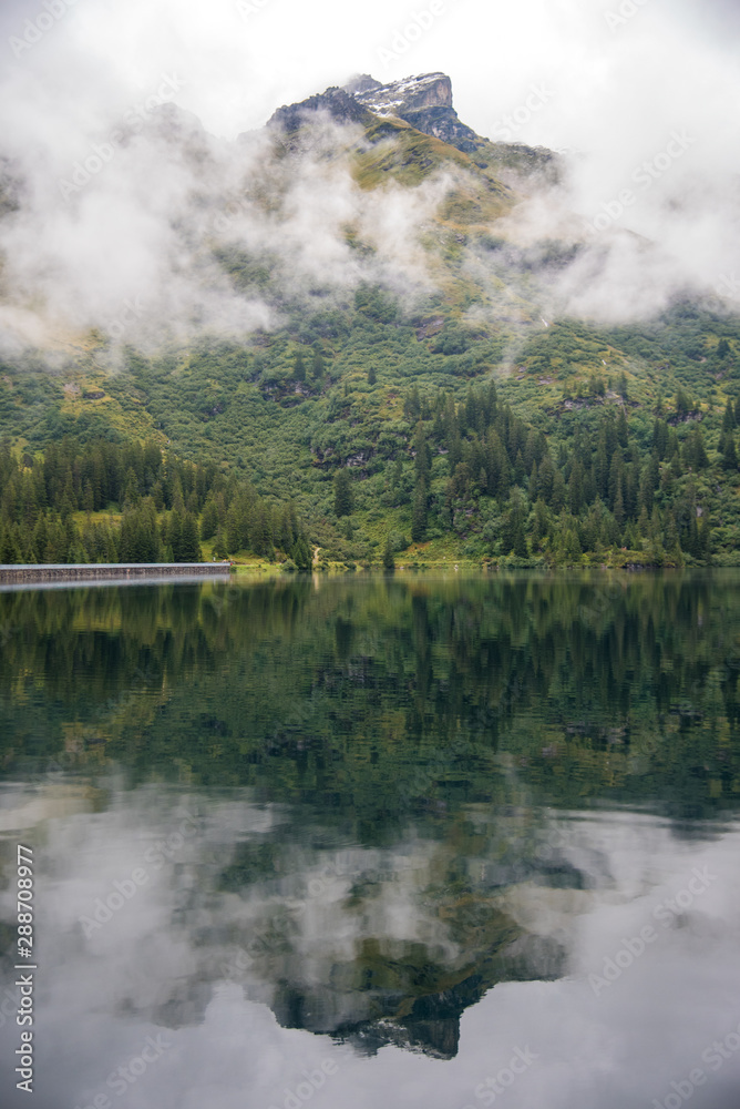 mountain, cloud, lake and reflection in the forest