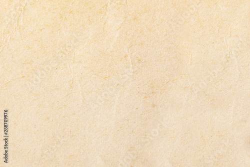 Texture of beige old paper, crumpled background. Vintage white grunge surface backdrop.