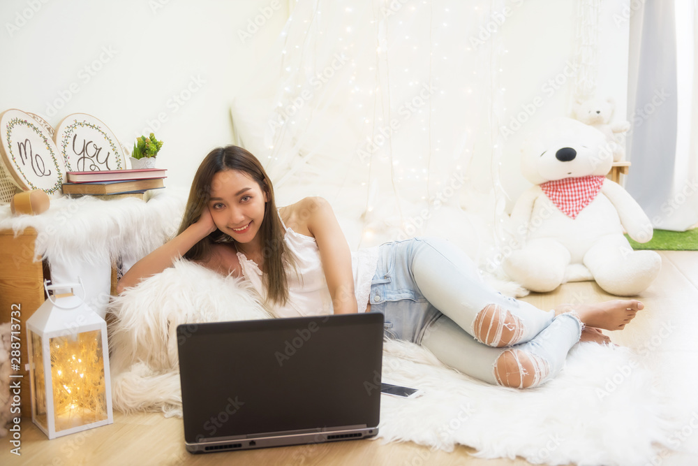 young woman with laptop in living room young woman with laptop in living room