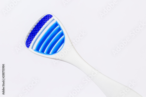 Toothbrush and tongue scraper