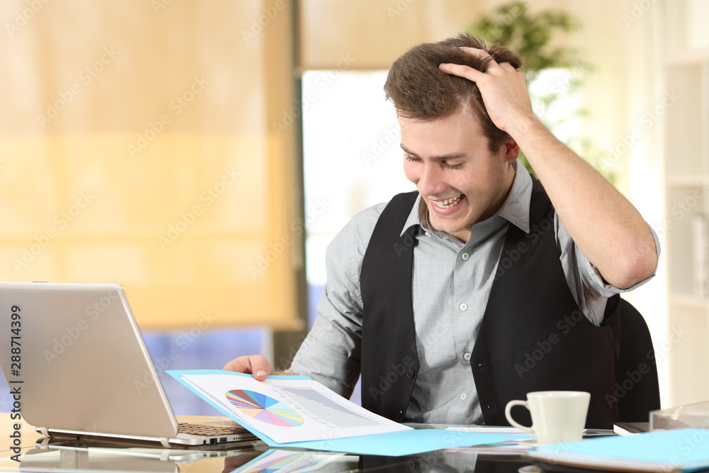 Excited businessman checking statistics on document Excited businessman checking statistics on document