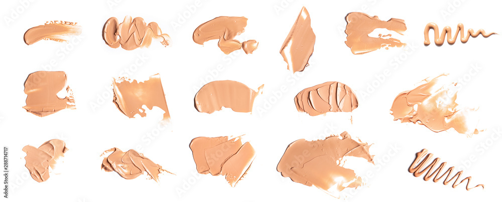 Set of Gently beige smears of makeup creamy foundation isolated on white background. Cosmetic concealer. Realistic brown cream texture for makeup.