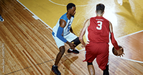 Professional basketball player in action on a sports arena