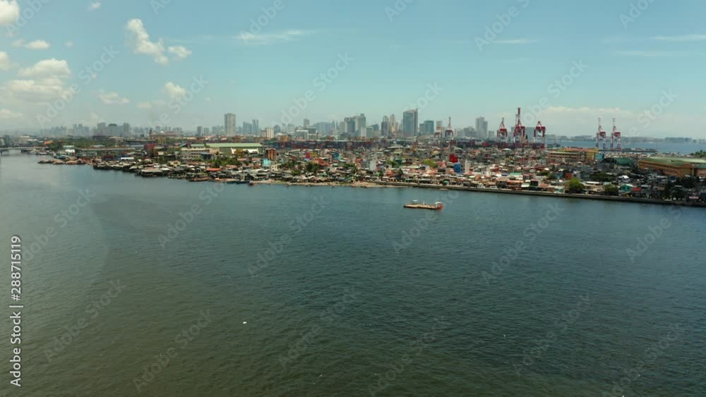 Manila city with port, skyscrapers, modern buildings and Makati business center aerial drone. Travel vacation concept Manila city with port, skyscrapers, modern buildings and Makati business center aerial drone. Travel vacation concept