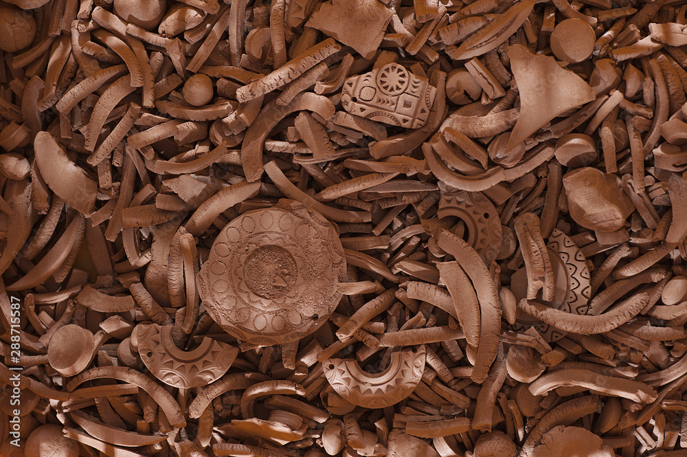Texture of clay shards.Fragments of ancient pottery. Archaeological finds from excavations. Texture of clay shards.Fragments of ancient pottery. Archaeological finds from excavations.