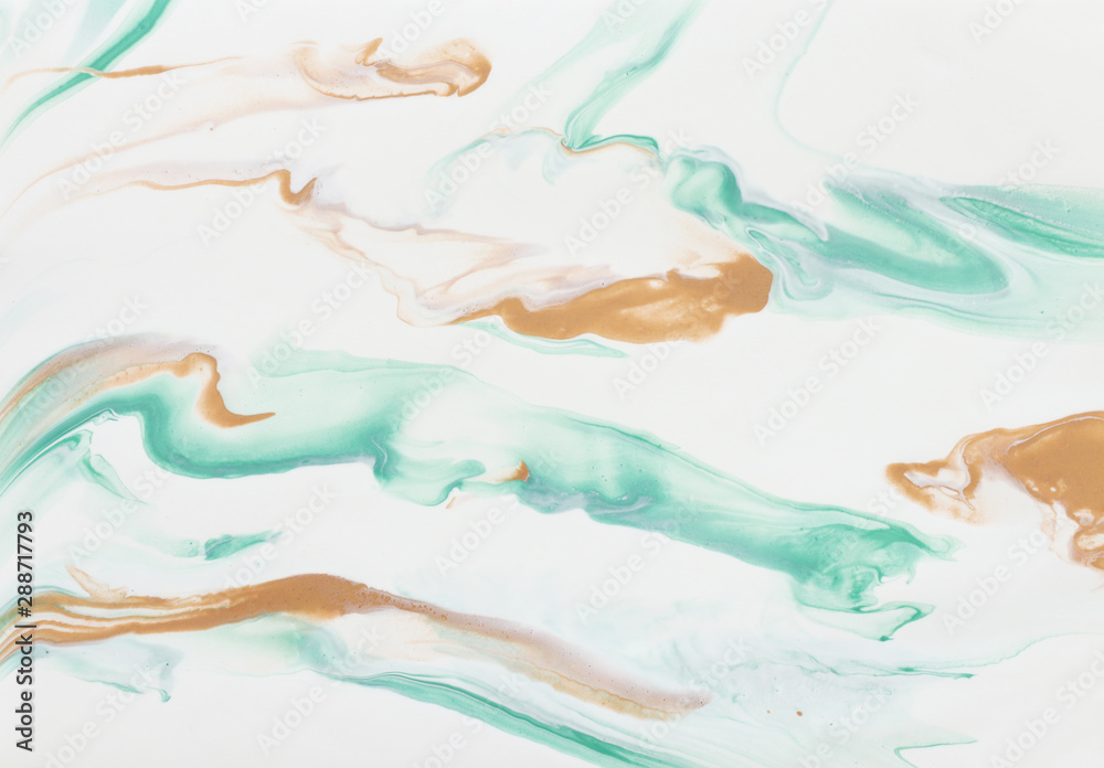 photography of abstract marbleized effect background. gold, mint and white creative colors. Beautiful paint