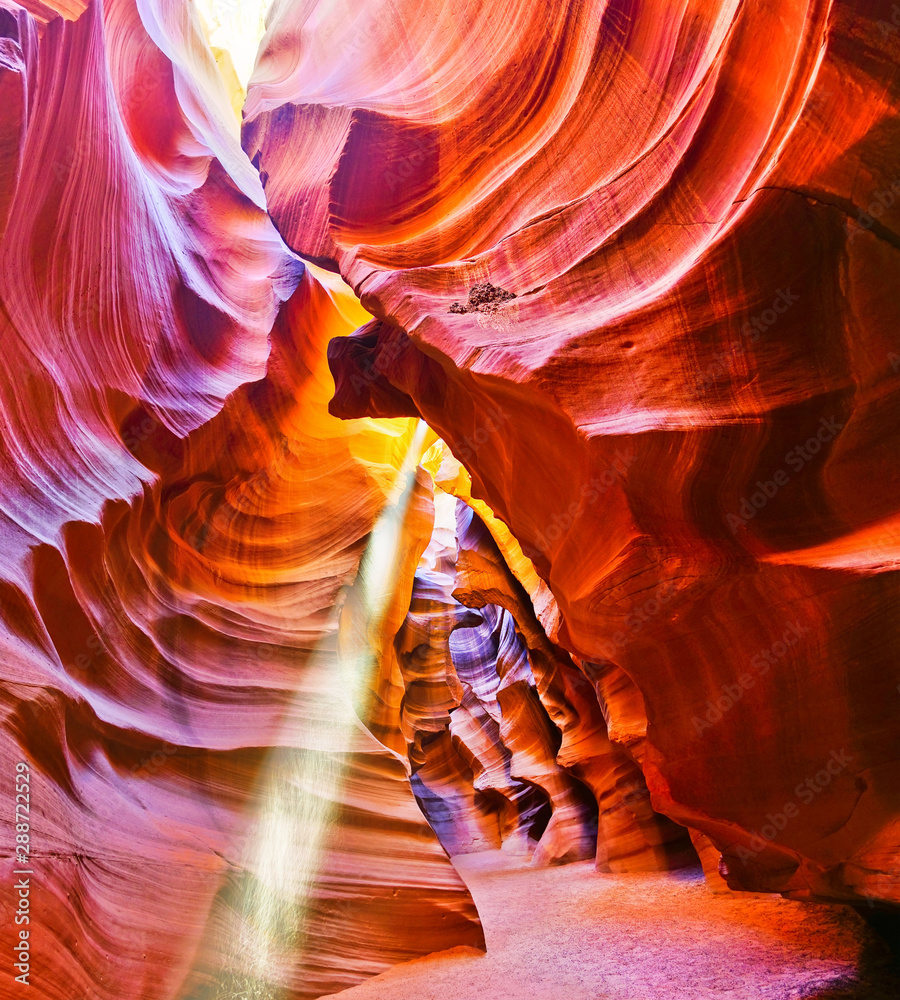 Fototapeta View of Upper Antelope Canyon with sunbeam shined into canyon at noon in early October in Arizona, USA.