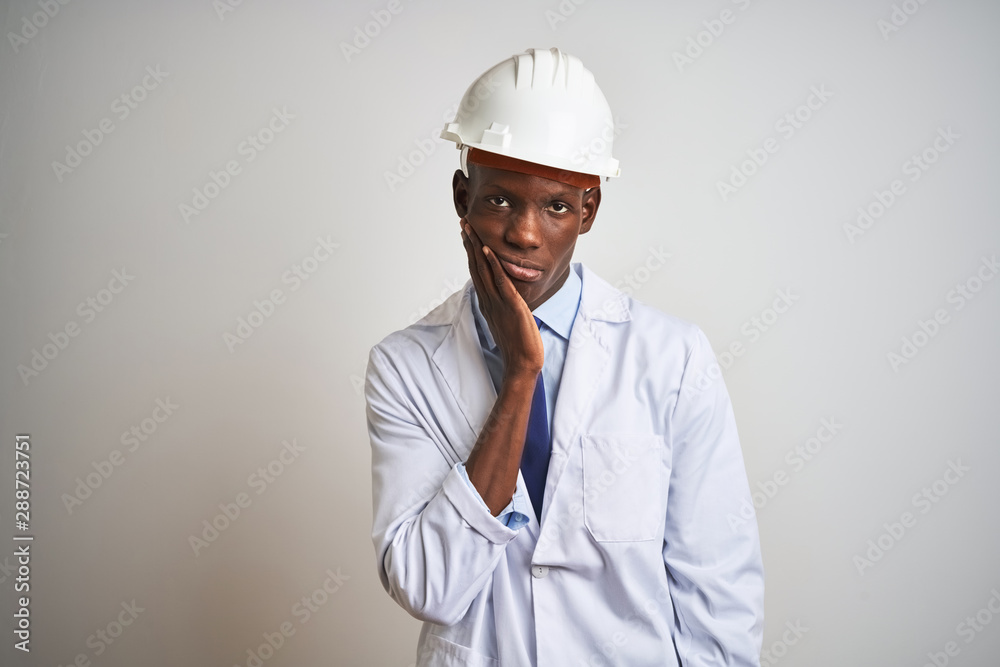African american engineer man wearing coat and helmet over isolated white background thinking looking tired and bored with depression problems with crossed arms.