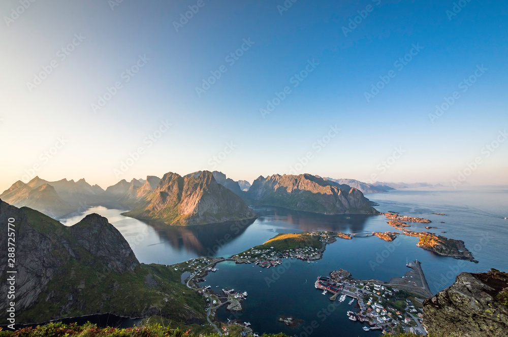 Beautiful scenery of Reine on top of Reinebringen during sunset time on a clear summer day, Lofoten Islands, North Norway