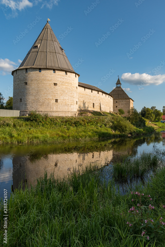 View to Elena river, Gate Tower and Strelochnaya Tower of the old medieval Old Ladoga Fortress in Russia