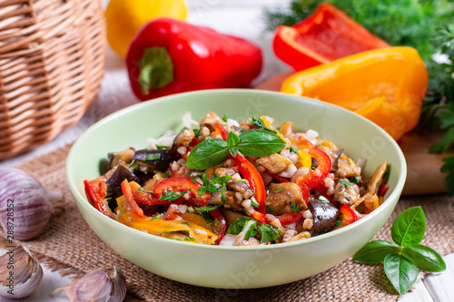 Salad with eggplant, pepper, onion and herbs