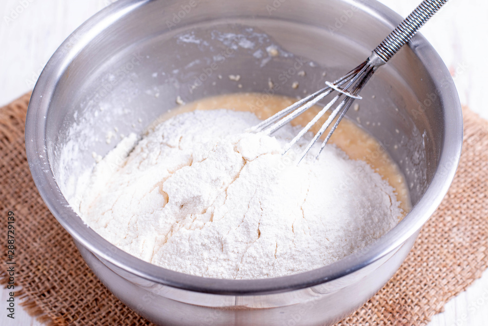 Flour in a bowl with dough Flour in a bowl with dough