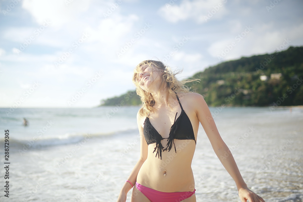 girl is having fun and jumping on beach freedom / concept freedom and summer beach, sporty graceful girl is jumping and having fun beach girl is having fun and jumping on beach freedom / concept freedom and summer beach, sporty graceful girl is jumping and having fun beach