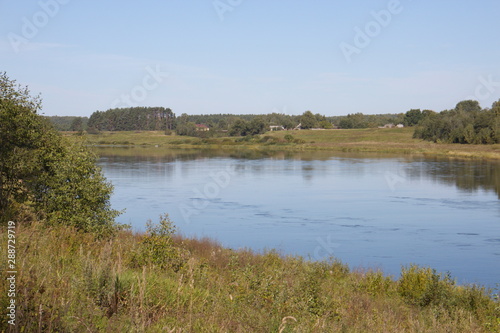 by the river on a clear summer day