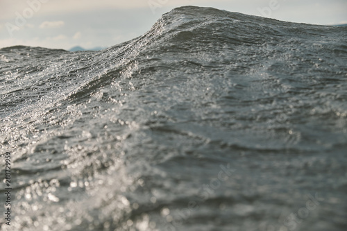 Cuadro en lienzo wave crest like mountain close up reflecting sun beams