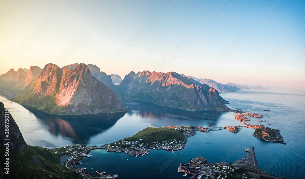 Beautiful panoramic scenery of Reine on top of Reinebringen during sunset time on a clear summer day, Lofoten Islands, North Norway