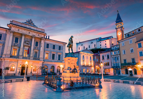 Impressive night view of Tartini Square in old town Piran. Splendid spring sunset in Slovenia, Europe. Traveling concept background. Beautiful Mediterranean cityscape.