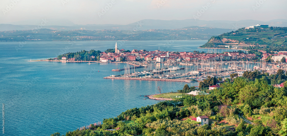 Aerial view of old fishing town Izola. Colorful spring  of seascape Adriatic Sea. Beautiful panorama of Slovenia, Europe. Beauty of countryside concept background.
