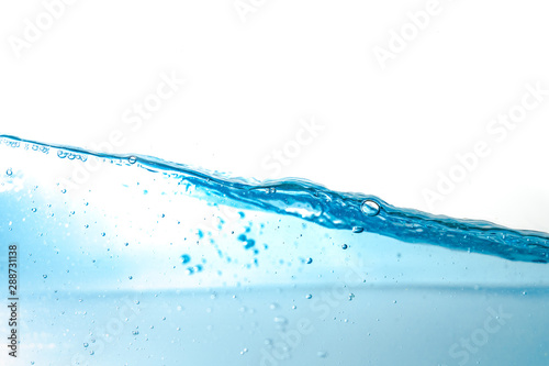 Water splash and air bubbles isolated over white background. Blue water wave abstract background isolated on white