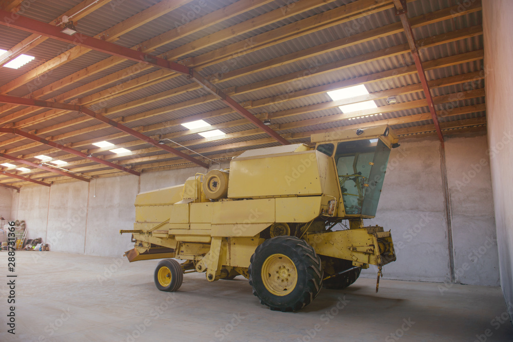 combine harvester in the garage