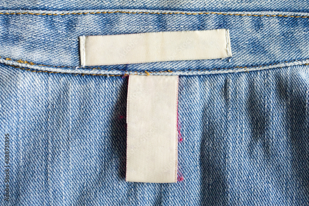 Blank white laundry care clothing label on denim jeans texture background  Stock Photo | Adobe Stock