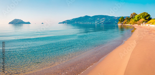 Fototapeta Naklejka Na Ścianę i Meble -  Stunning morning view of beach of Zakynthos (Zante) island. Sunny spring seascape of the Ionian Sea, Greece, Europe. Beauty of nature concept background.
