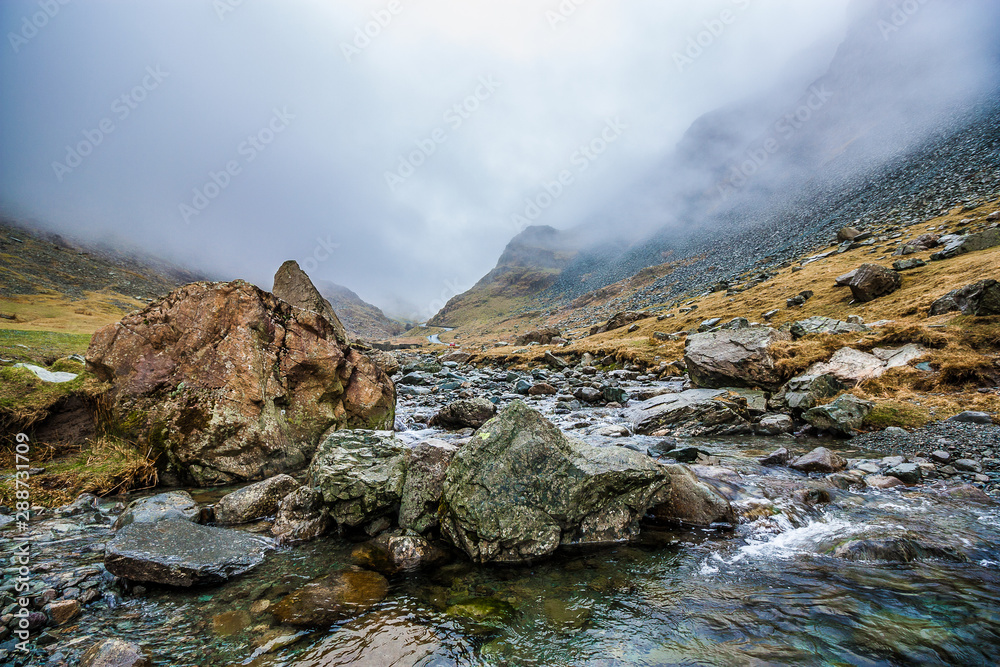 Fototapeta premium River from Honister Pass on a Foggy Day, Lake District, UK, 2015
