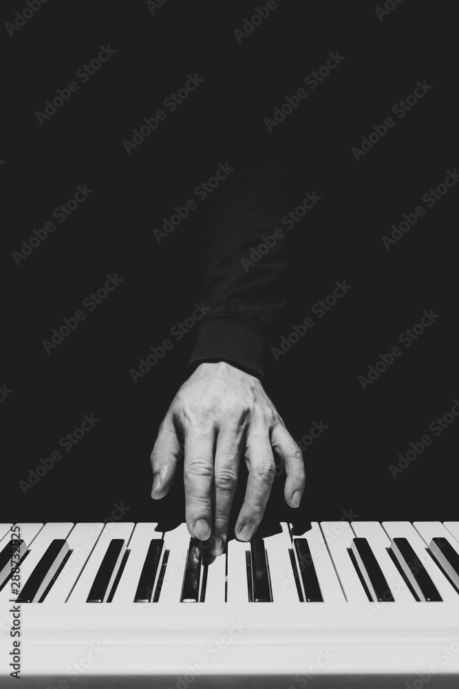 BW male musician hand playing on piano keys. music background Stock Photo |  Adobe Stock