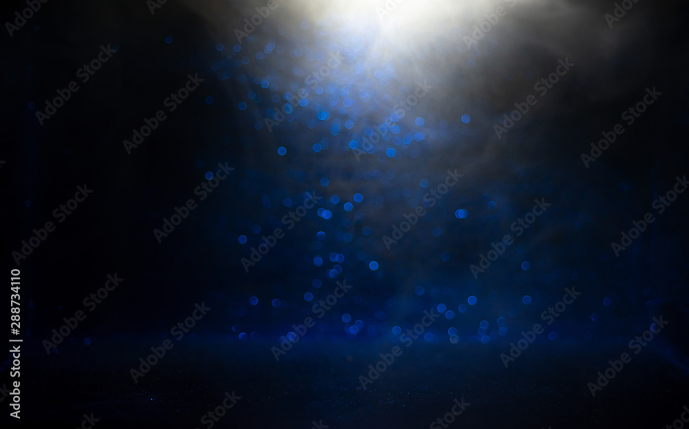 Light and shadow, blue sparkling texture on a black background