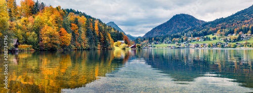 Panoramic autumn view on Grundlsee lake. Gereat morning scene of Brauhof village  Styria stare of Austria  Europe. Colorful view of Alps. Traveling concept background.
