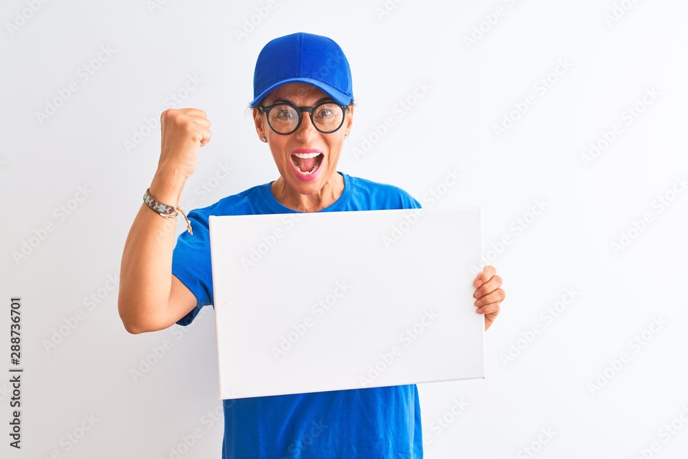 Senior deliverywoman wearing cap and glasses holding banner over isolated white background annoyed and frustrated shouting with anger, crazy and yelling with raised hand, anger concept Senior deliverywoman wearing cap and glasses holding banner over isolated white background annoyed and frustrated shouting with anger, crazy and yelling with raised hand, anger concept