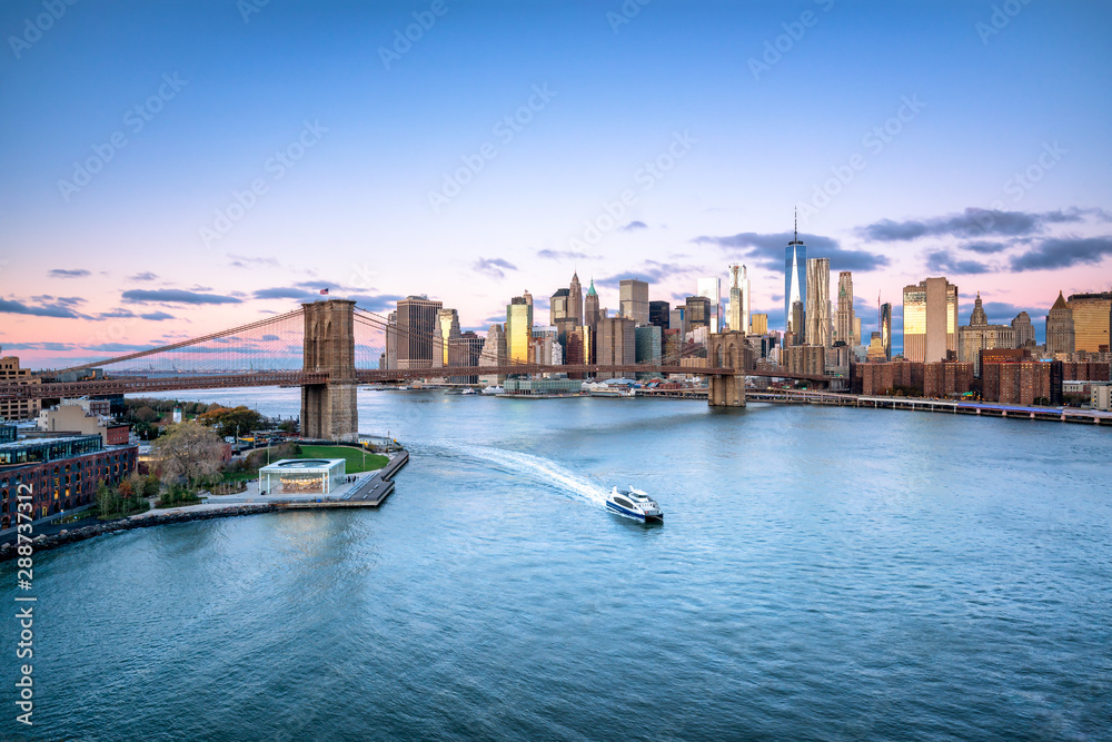 Aerial view of the Manhattan skyline and Brooklyn Bridge in New York City, USA
