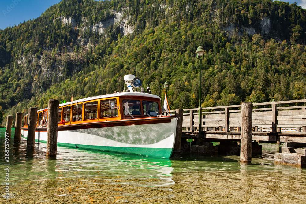 Electric tourist boats on beautiful lake Konigssee pier Berchtesgaden National Park Bavaria Germany Electric tourist boats on beautiful lake Konigssee pier Berchtesgaden National Park Bavaria Germany