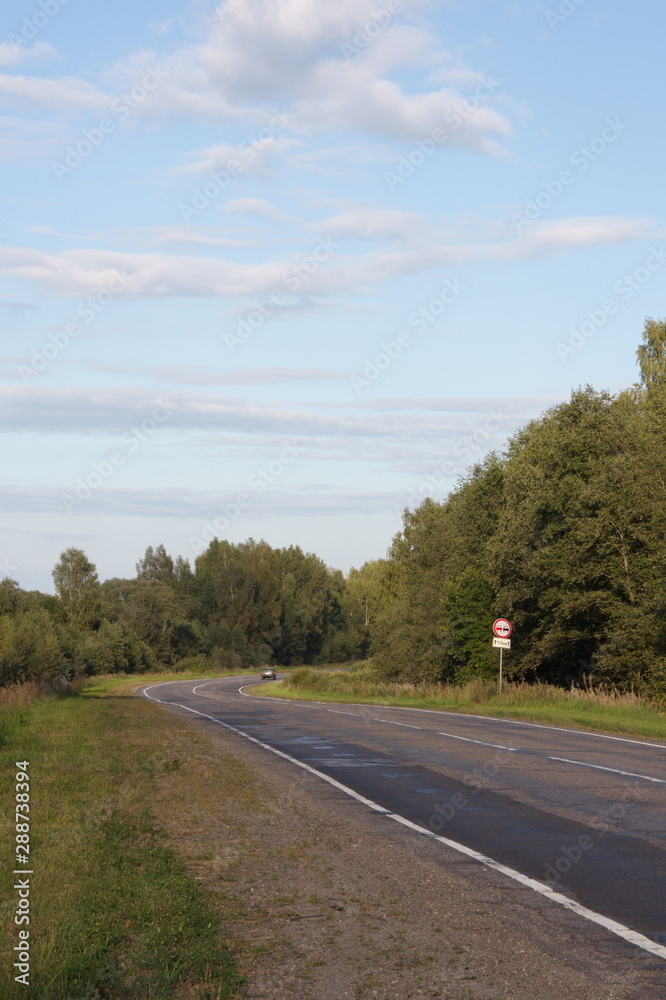 Fototapeta premium road in the countryside on a summer evening