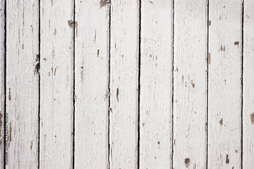 White wood background. Scratched white paint on a wooden plank wall. Background, texture