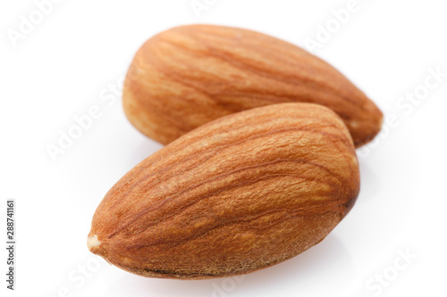 almonds isolated on white background close up. macro shot