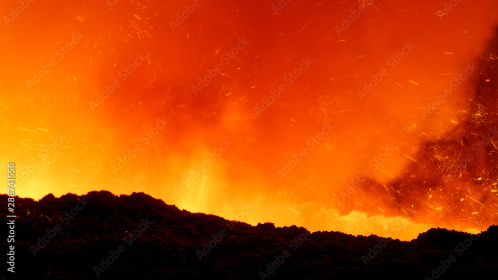 Naklejka premium molten iron flows out of the blast furnace
